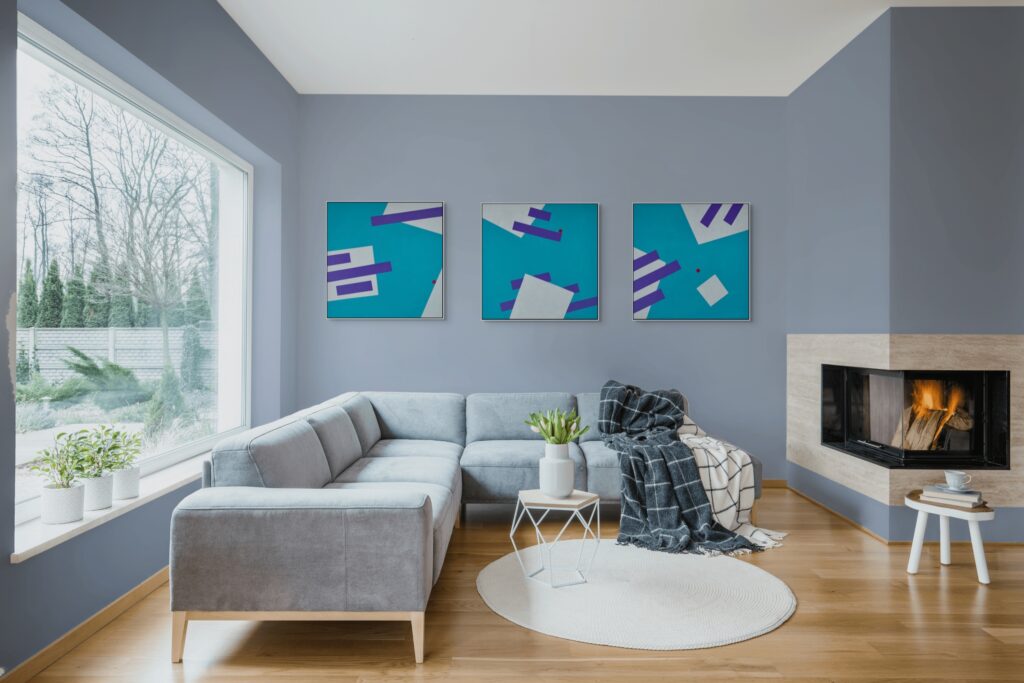 Geometric abstract art in living room 02 - Gravity Triptych Paintings by Adra