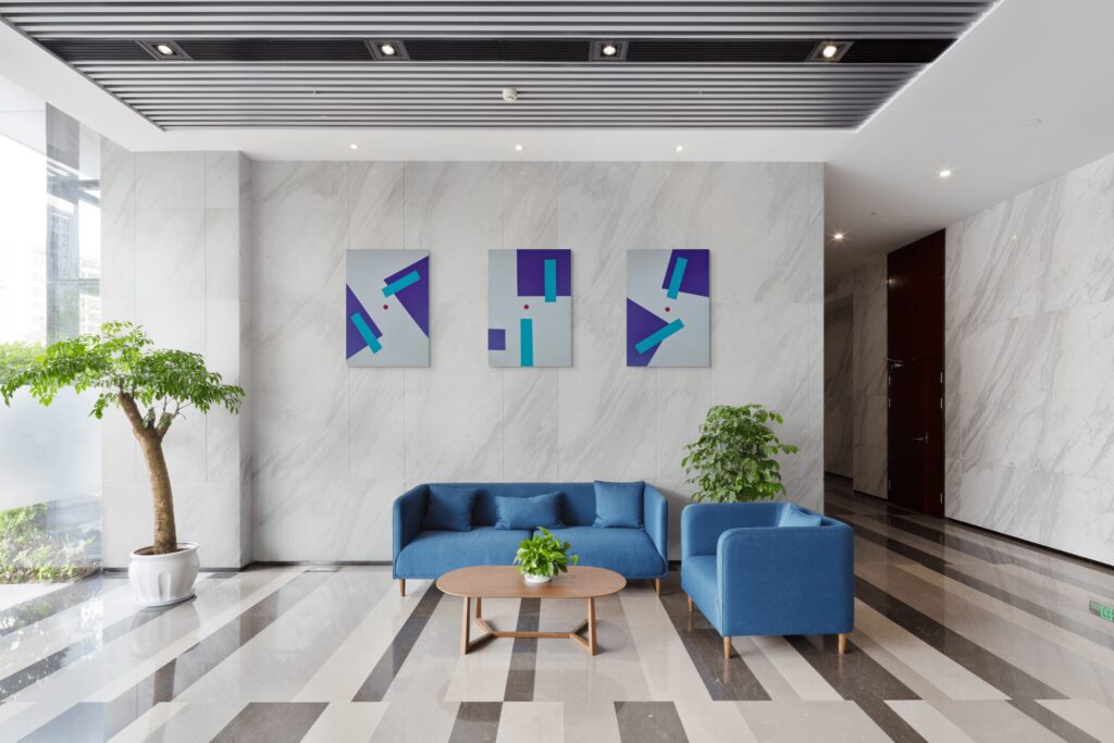 Textured geometric art paintings by Adra - Sensations Triptych in modern office lobby